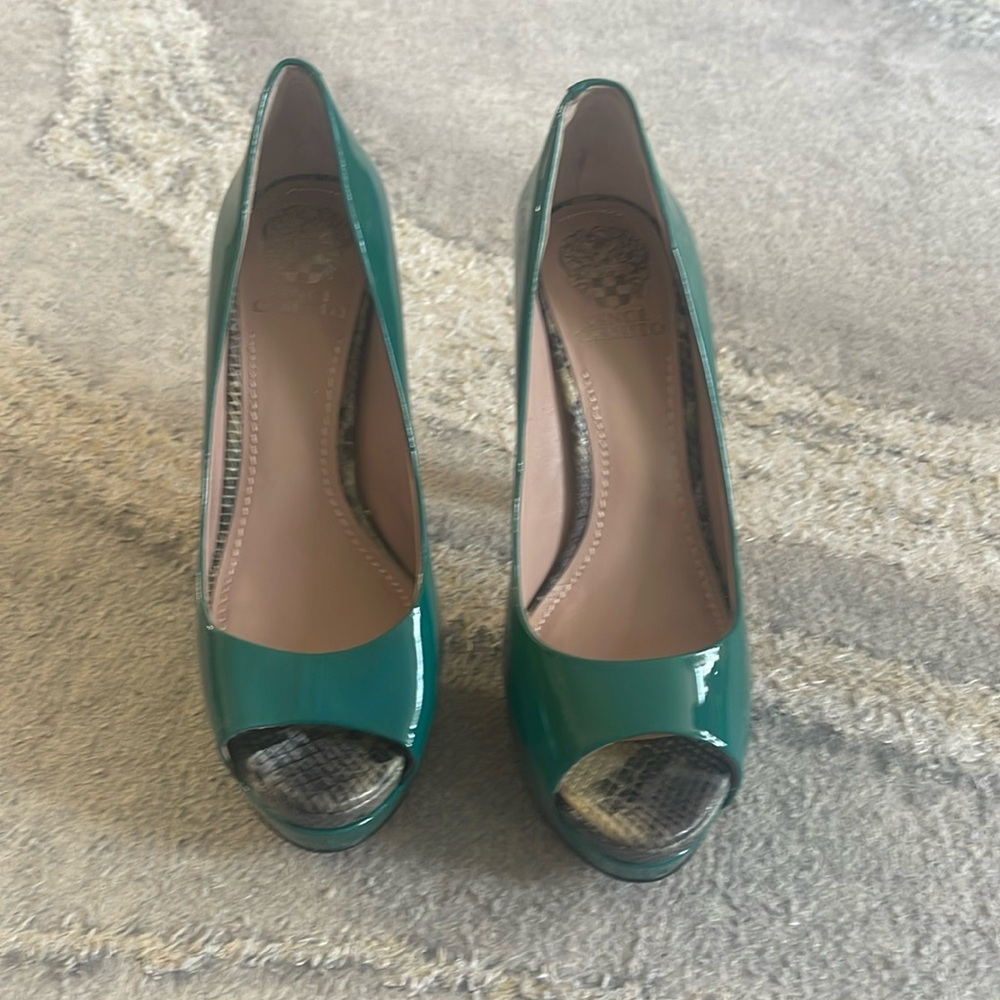 Pumps in shiny green by VINCE CAMUTO. Size 9. Heel size 5 1/2 inch.